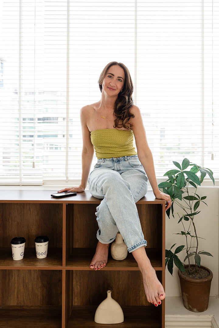 Emily Rose Dallara at home, seated and open